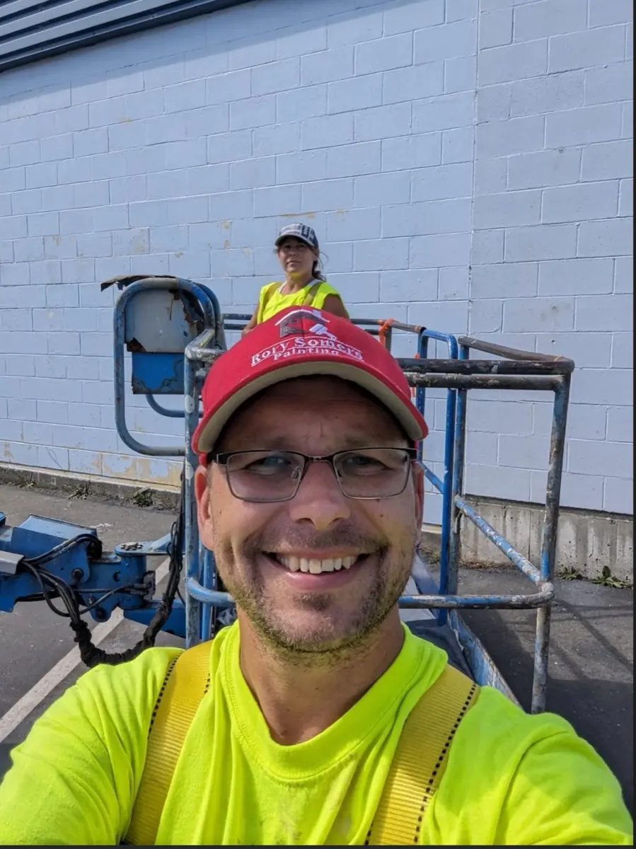 Rory, with Amber behind him on a boom lift