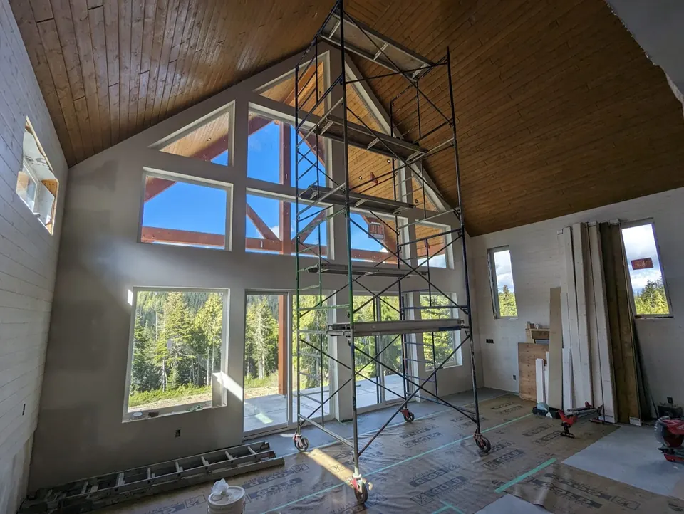 Scaffolding in a tall great room during painting